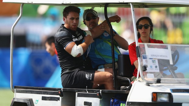 Photo : David Rodgers / Joe Webber driven off the pitch in a medi-cab.